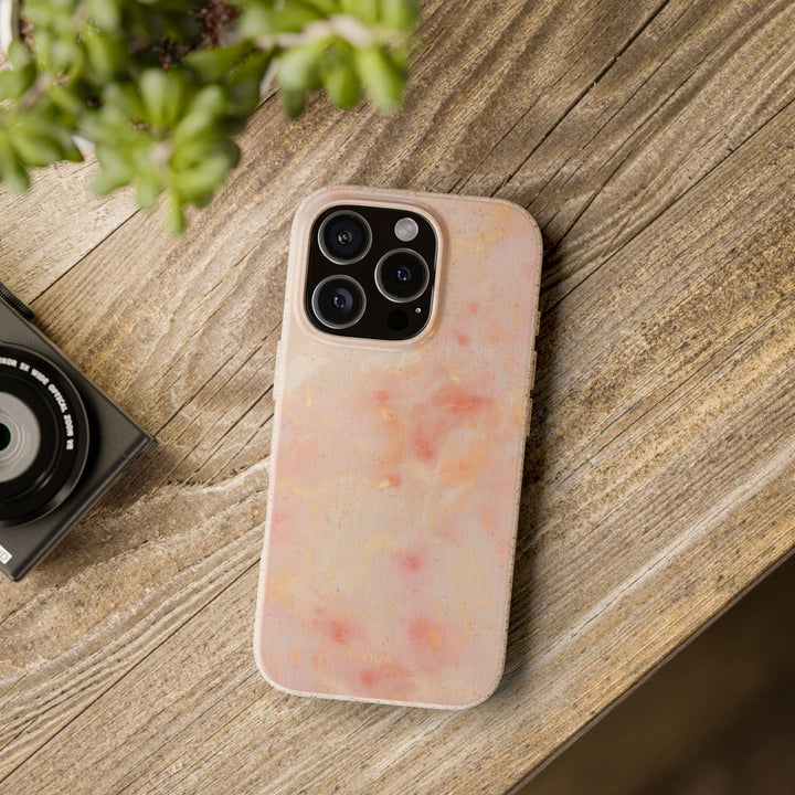 Eco-friendly biodegradable marble design phone case on a wooden table, compatible with many iPhone and Samsung models.