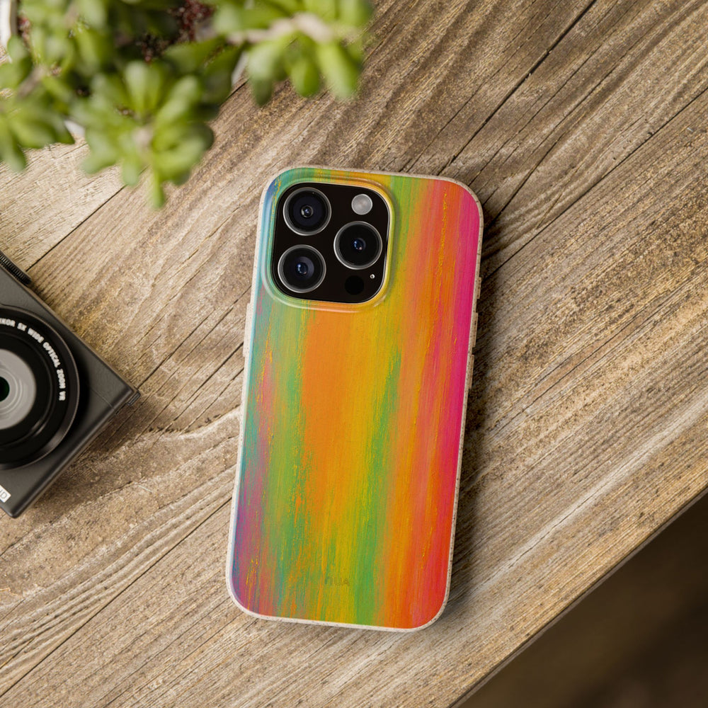Eco-friendly Radiant Rush rainbow phone case on table, fits many iPhone and Samsung models, durable vibrant brush color design.