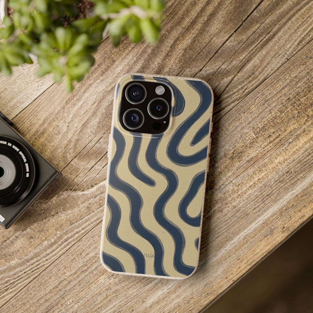 Eco-friendly Wavy Lux Phone Case on wooden table, designed for iPhone and Samsung models, showcasing vibrant wavy design in matte finish.