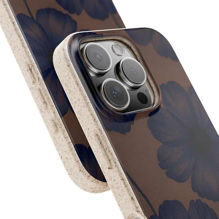 Eco-friendly Midnight Petals phone cover with deep blue flowers on mauve, fitting many iPhone and Samsung models, durable and stylish.