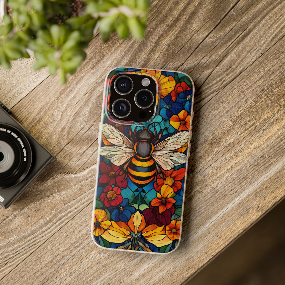 Eco-friendly vibrant bee floral iPhone case on wooden table; ideal for nature lovers with durable, biodegradable PLA design.