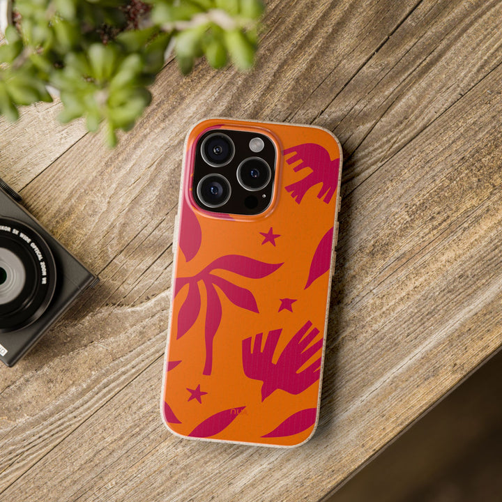 Eco-friendly Tropic Flight iPhone case on wooden table, showcasing vibrant palm design and durable construction for many phone models.