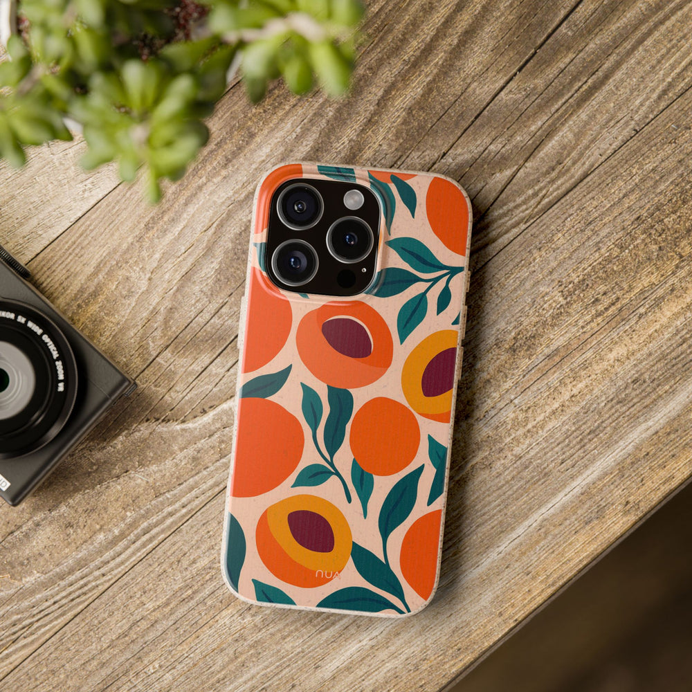 Eco-friendly Peachy Summer Garden iPhone case with vibrant design on wooden table, compatible with many iPhone and Samsung models.