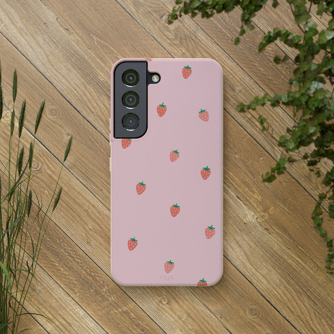 Strawberry pattern eco-friendly Samsung case on wooden background, showcasing sustainable design for various phone models.