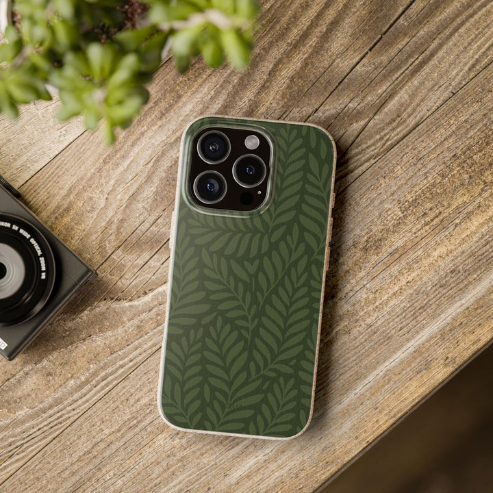 Deep Forest Whisper iPhone case on wood table, eco-friendly and durable. Fits many iPhone and Samsung models. Biodegradable and stylish.