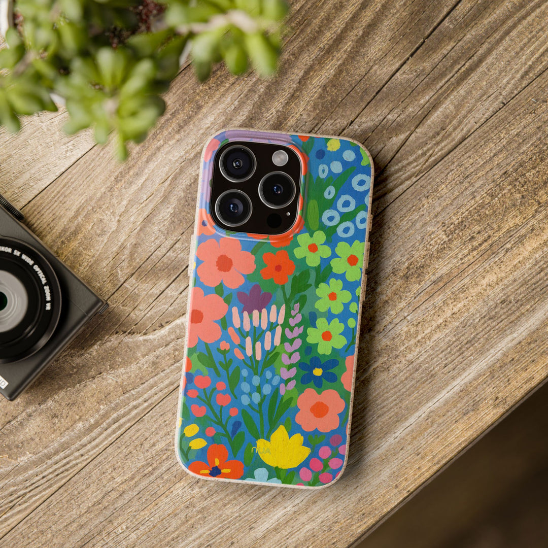 Eco-friendly painted iPhone case with vibrant floral design, durable and compatible with many iPhone models on wooden table.