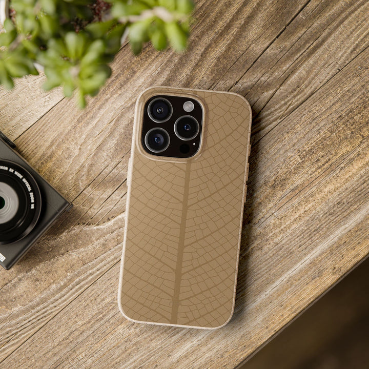 Eco-friendly iPhone case on wooden table, featuring nature-inspired design, fits many iPhone and Samsung models, durable and stylish.